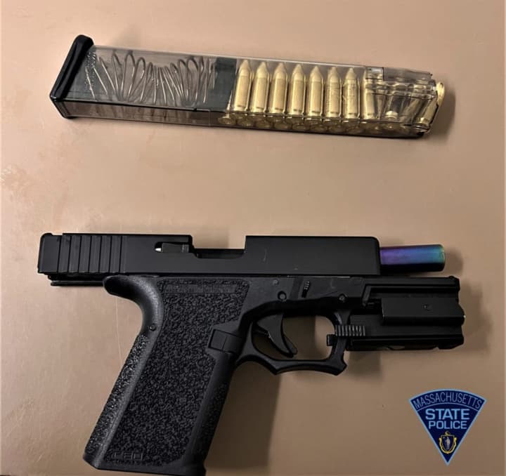 A Massachusetts man is facing charges after police said a traffic stop led to the discovery of a firearm and ammunition.