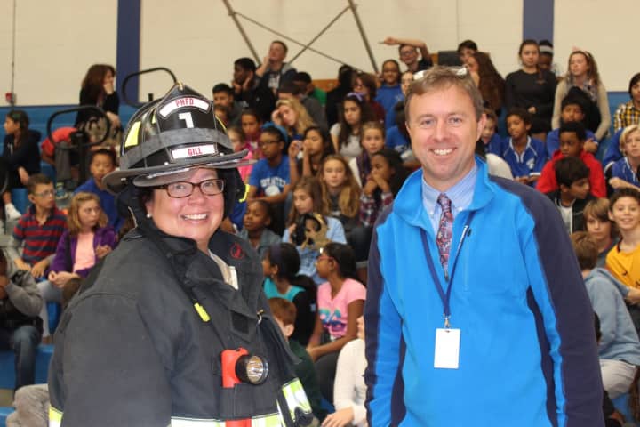 Firefighter Jennifer Gill Mahood and Interim Principal Adam Brown at a recent fire safety program at Pocantico Hills School.
