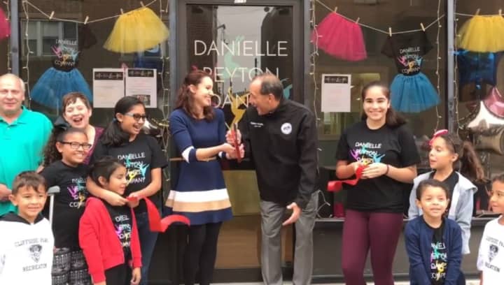 Danielle Peyton and Cliffside Park Mayor Thomas Calabrese cut the ribbon on her new studio.