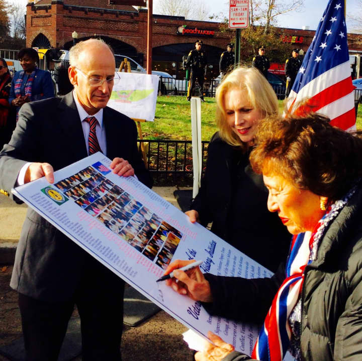 U.S. Rep. Nita Lowey, D-Westchester/Rockland, signed a poster on Wednesday with photos and names of the 150 veterans who participated in the Greenburgh &quot;Living History Initiative.&quot; It was part of a ceremony at a future town Veterans Memorial Park.