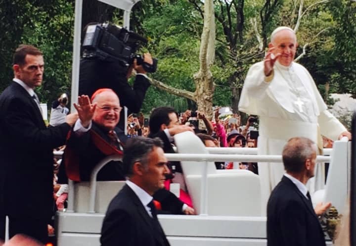 Pope Francis and Cardinal Timothy Dolan wave to onlookers in Central Park during the pope&#x27;s visit to New York City in 2015.