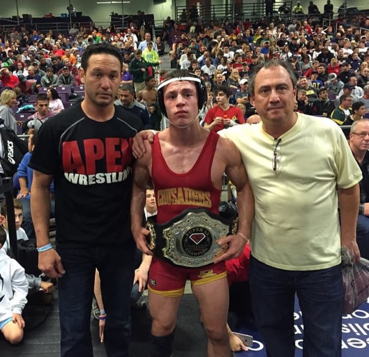 Bergen Catholic&#x27;s Nick Suriano with coach Damion Logan, left, and his father, Bob Suriano.