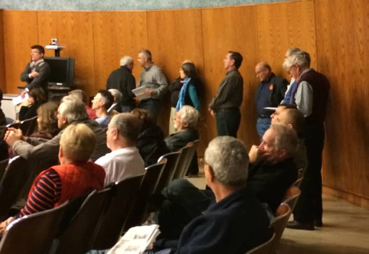 Members of the public line up Monday night to speak out against a project that would have brought more than 400 rental units to Wayne.