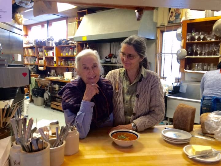 Selma Miriam and Noel Furie in the Bloodroot kitchen with a bowl of Hungarian cabbage soup.
