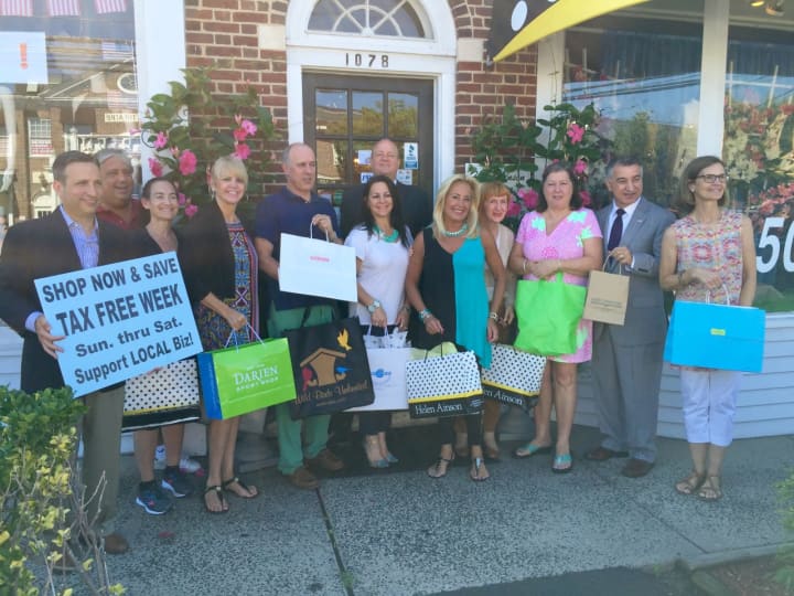 Several officials and representatives from Darien businesses recently posed for a photo in front of Helen Aison on the Post Road to promote Connecticut&#x27;s tax-free shopping week.