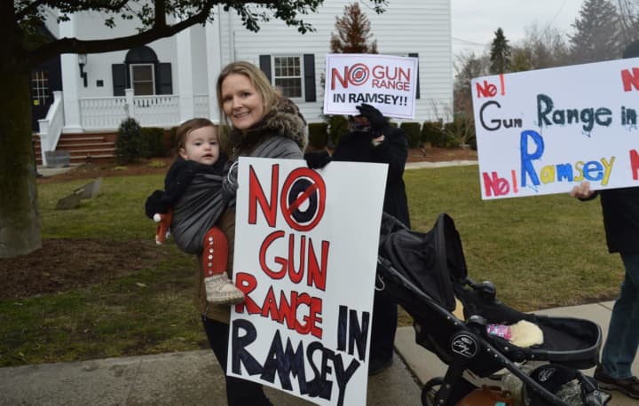 Ramsey residents demonstrated in front of borough hall Wednesday to raise awareness about a pending gun range.