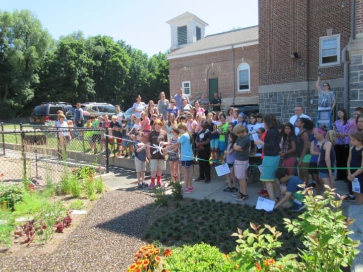 Main Street School students, teachers and administrators held a ribbon-cutting ceremony for the school garden on June 21.