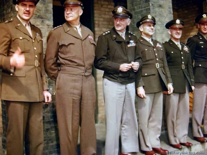 Uniforms worn by WWII soldiers are on display in the Teaneck Public Library.
