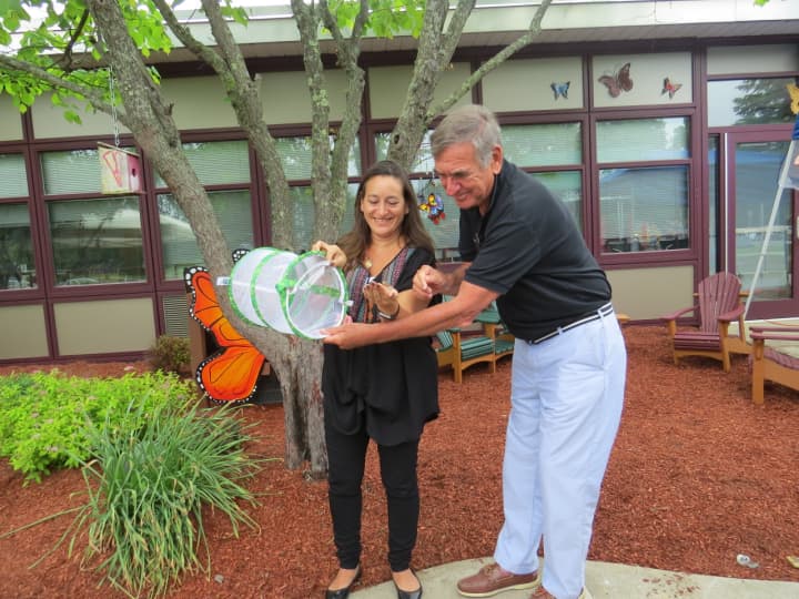 Outdoor reading spaces at two elementary schools in Yorktown were dedicated to the memory of former teacher Carole Jacobson. Her husband and daughter, Debbie Jacobson and Gil Jacobson, are shown at a June 3 ceremony.