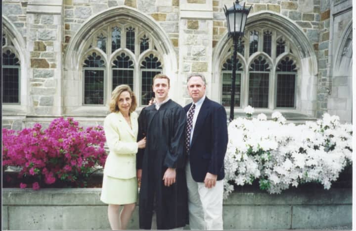 A graduation photo of Upper Nyack resident Welles Crowther flanked by his parents, Alison and Jefferson.