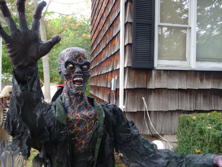 Dennis Morton&#x27;s Waldwick yard is decorated with many human-sized figures like monsters and zombies.