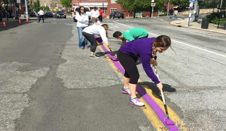 Harrison High School will hold a Relay for Life event Saturday and Sunday to raise money for the American Cancer Society. To get ready, the have been painting the town purple.
