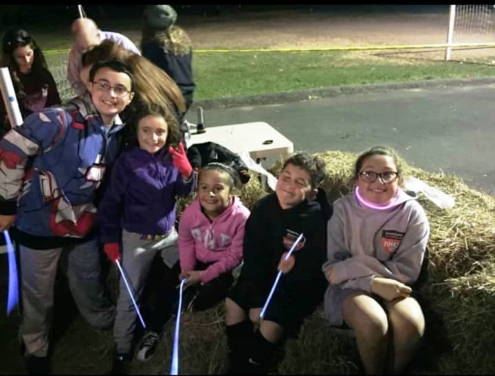 Matthew, Nina, Samantha, Joe and Jacqueline wait for a ride on the haunted hayride at Hasbrouck Heights 2015 Halloween in the Park.