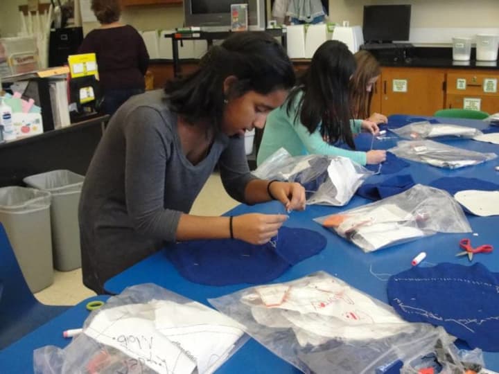 Irvington Middle School sixth-graders hand-stitched cartoon pillows in Teresa Hunt’s home and careers class.