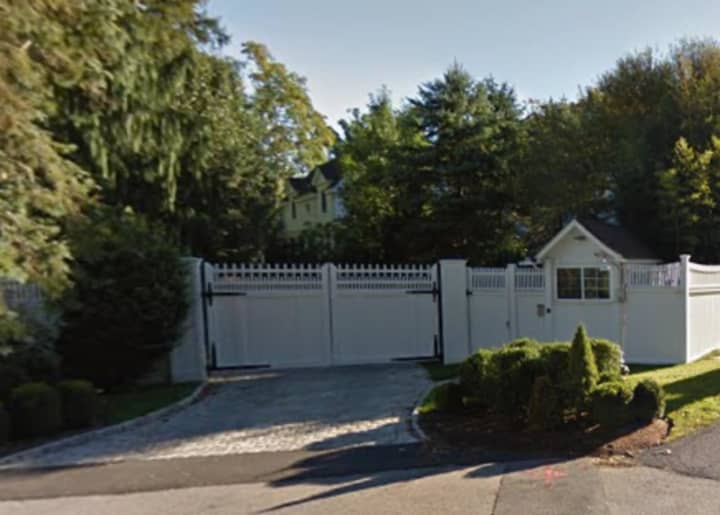 Hillary and Bill Clinton fans can just get a tiny peek at their Chappaqua house over its white picket fence on Old House Lane. The property is guarded by the Secret Service.