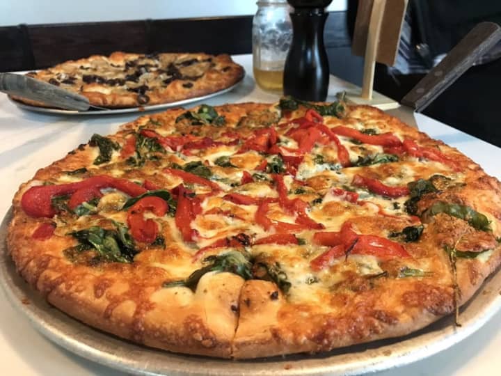 A &quot;Pizza Jane&quot; from Hillside Pizza in Hadley, made with olive oil, garlic sauce, spinach, basil and roasted red peppers.