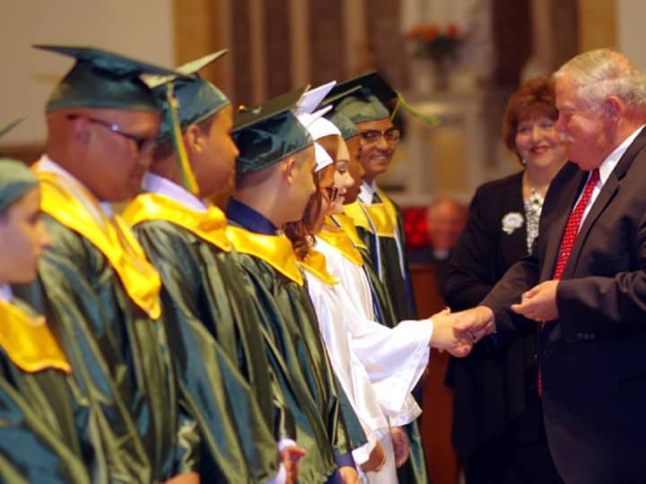 St. Joseph Academy Principal James Newman congratulates the 2016 graduates.