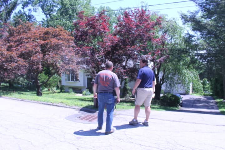 Asst. Chief William Nikisher of the Mahopac Volunteer Fire Departments meets with Town of Carmel Building Inspector Mike Carnazza regarding the safety of the structure.