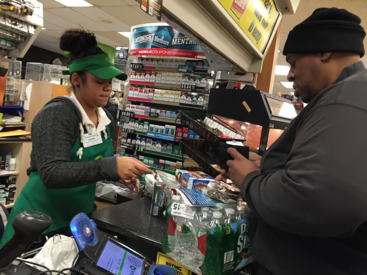 Melvin of Teaneck purchases a Powerball ticket along with a case of water at QuickChek in Bogota.