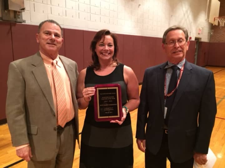 (from left) Superintendent of Schools Joseph Abate, McKenzie School Teacher of the Year Beth Narkiewicz and East Rutherford Board of Education President Paul Weiss