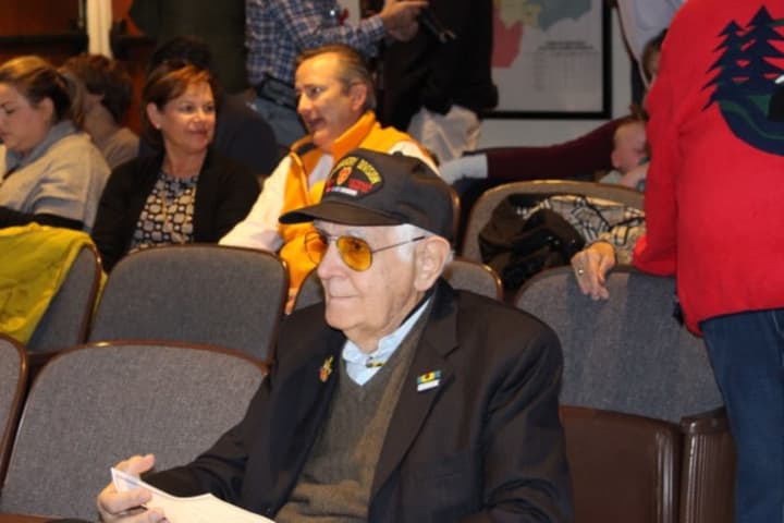 Alex Boboc, 84, of Westport, awaits the start of Veterans Day services at Westport Town Hall. He is a veteran of the Korean War, and his brother John served in World War II.