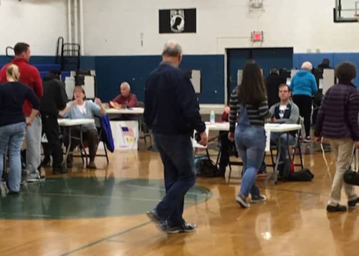 Voters enter the gym at the War Memorial in Danbury to cast their ballots on Tuesday, Nov. 8. The state will be conducting hand counts of votes cast at random polling places that used optical scanners.