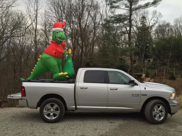 It&#x27;s a Lewisboro tradition for Santa to leave a little &quot;present&quot; on the lawns of neighbors and friends at Christmastime. Here, DinoClaus arrives at his new holiday home in South Salem.
