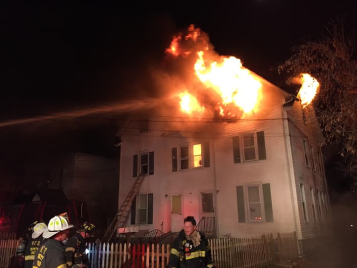 Norwalk firefighters responded to a fire at a three-story multifamily home on Cove Avenue Monday night.