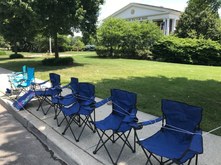 Chairs are set up on North Maple Avenue in front of Ridgewood Village Hall.