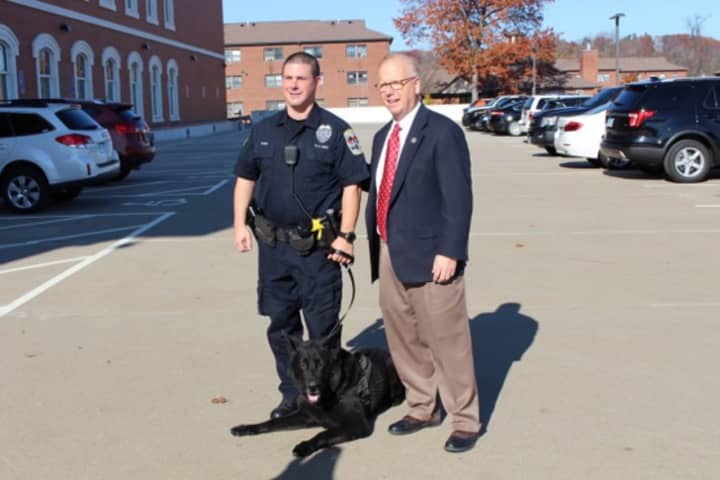 Officer Greg Topa and K-9 Zeke, of the Danbury Police Department, stand with Danbury Mayor Mark Boughton outside the station after a ceremony during which the DPD received a significant donation from the Gleszer estate supporting the K-9 program.
