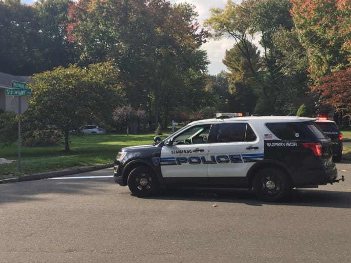 A Stamford man fired back after a gunman shot his friend in the stomach Saturday afternoon.