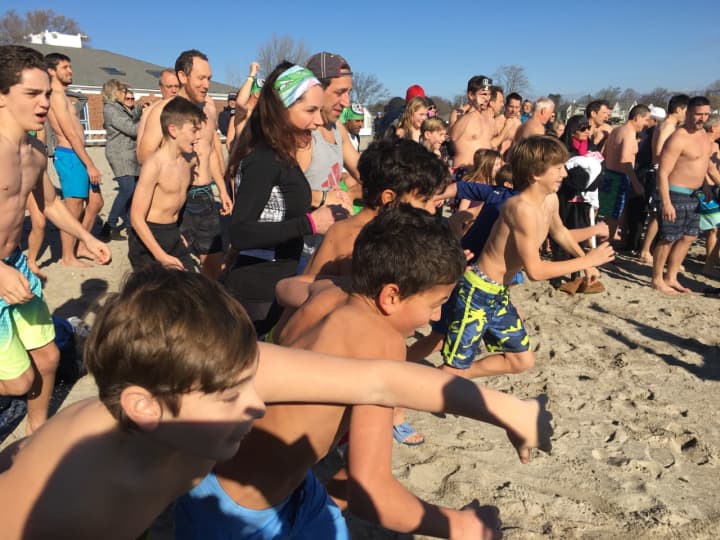 Plungers head for Long Island Sound for the 10th annual Polar Plunge at Westport&#x27;s Compo Beach.