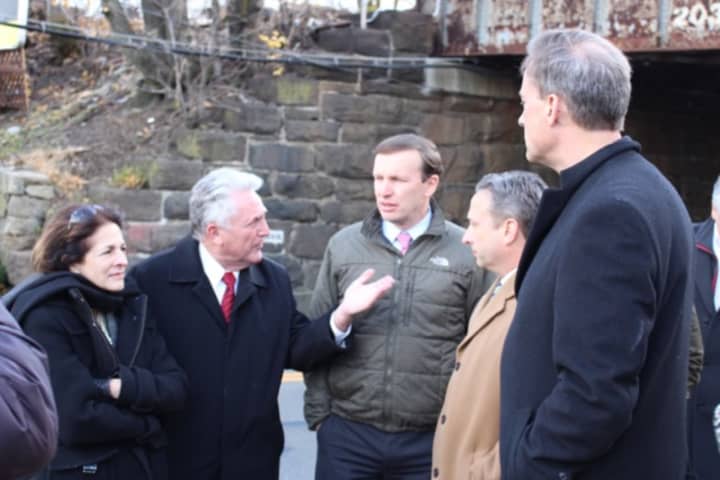 Braving cold and wind, State Rep. Gail Lavielle, Norwalk Mayor Harry Rilling, U.S. Sen. Chris Murphy, State Sen. Bob Duff and State Rep. Fred Wilms discuss needed improvements to the East Norwalk train station and vicinity.