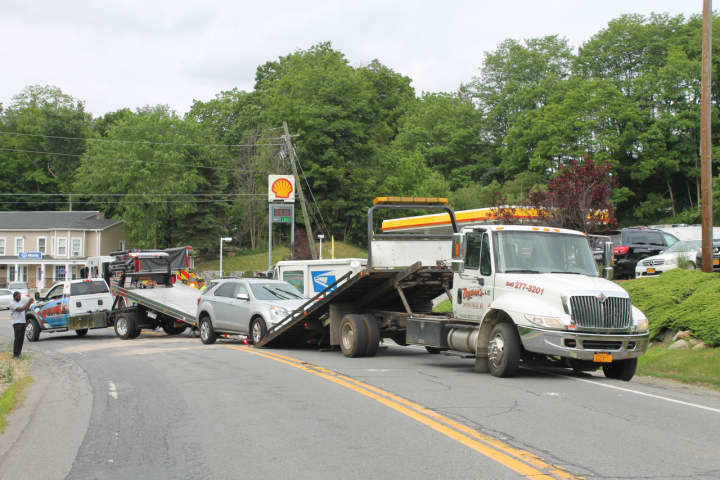 Traffic remained at a complete stop as the vehicles were loaded onto flatbeds and removed from the scene.