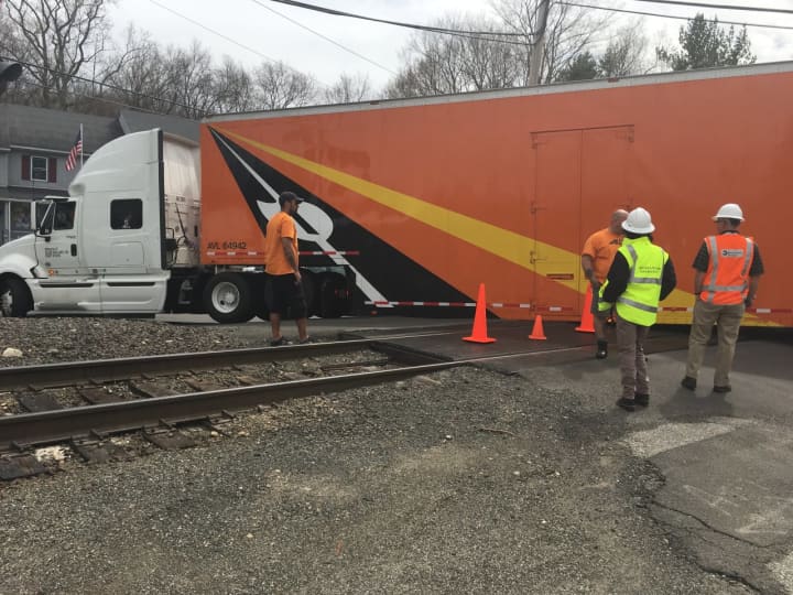 An 18-wheeler is stuck on the tracks on Long Ridge Road near the West Redding train station, stalling Metro-North service for hours on the Danbury Branch.
