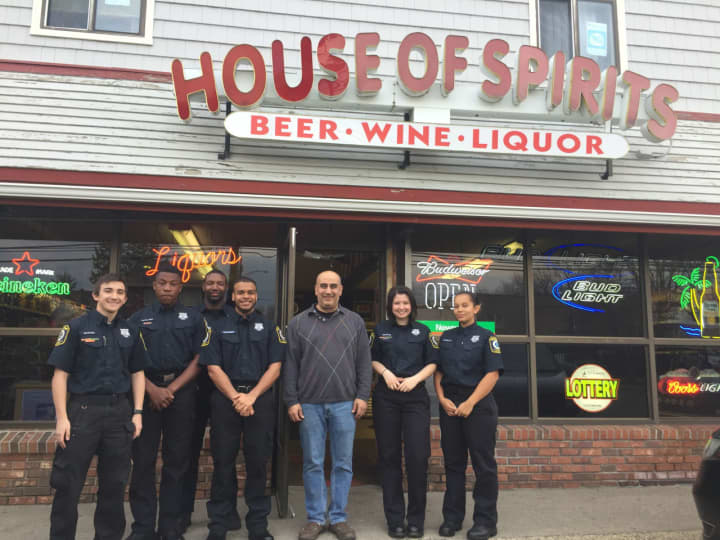 Stratford Police Explorers with Albert Permonzono (center), owner of The House of Spirits. From left: Ken Shafer, Sean Excellent, advisor James Jackson, Devin Toth, Danielle Gordon and Anginette Repollet