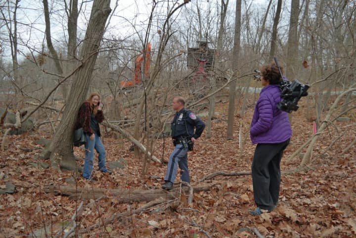 Nancy Vann prevents workers from cutting trees in protest of the Spectra pipeline.