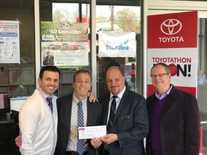 Tony Dovolani, left, poses with Kennedy Center President Martin Schwartz, Salvatore Giugno of Toyota of Stamford and Stratford resident George Perham of Antinozzi Associates, who organized the charity event.