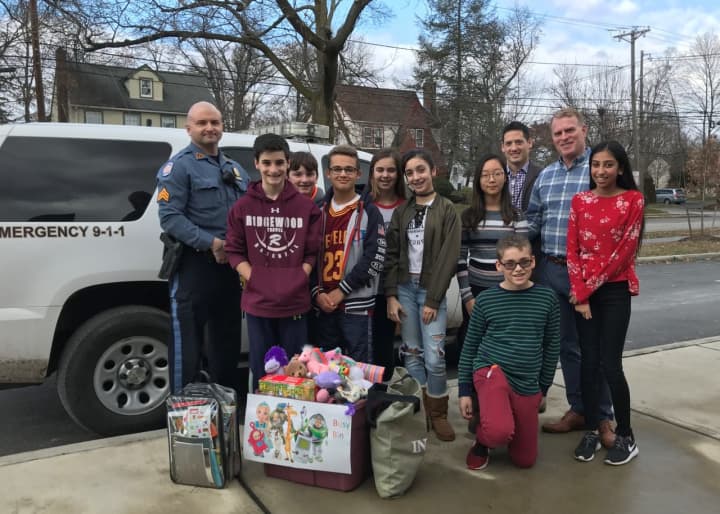 A group of Ben Franklin Middle School students collected a bin of toys for the Ridgewood Police Department.