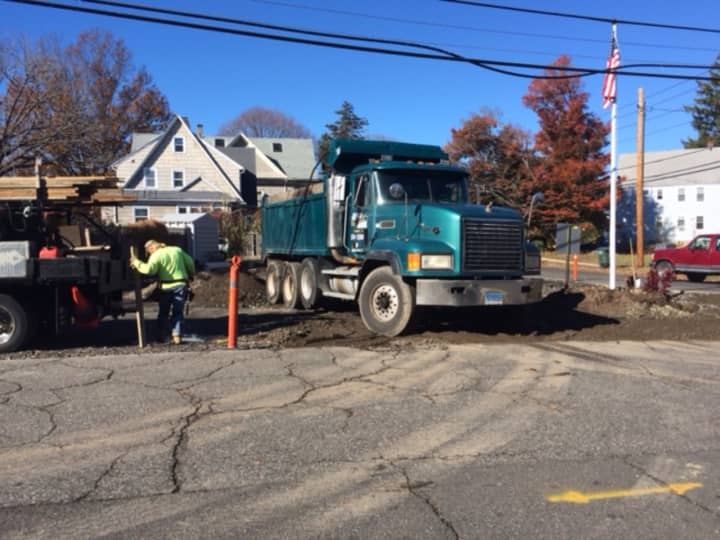 Workers break up pavement to make room for a new pocket park in Bridgeport&#x27;s Black Rock neighborhood.