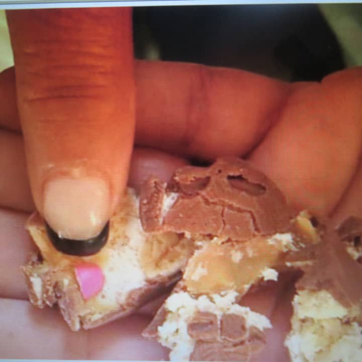Joann Turner of Wappingers Falls posted this photo of a pink pill that she told Town of Poughkeepsie police was found in her daughter&#x27;s Snickers bar, collected during a Saturday Mall-O-Ween event at Poughkeepsie Galleria off Route 9.