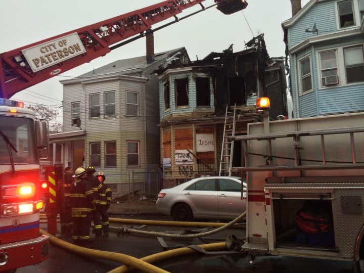 Firefighters respond to a Paterson blaze on Walnut Street Wednesday, Dec. 23. 
