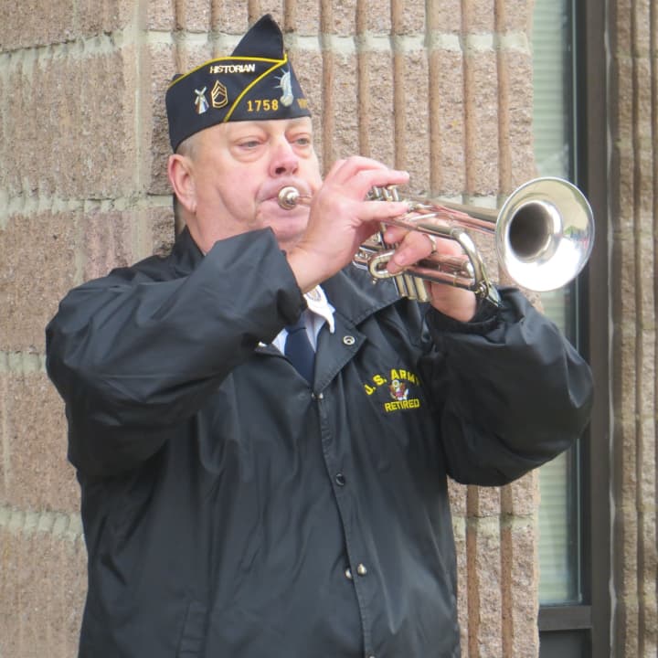 Vincent Richards, a retired veteran from the 319th Army Band, played taps at Wednesday&#x27;s ceremony in Wappingers Falls.