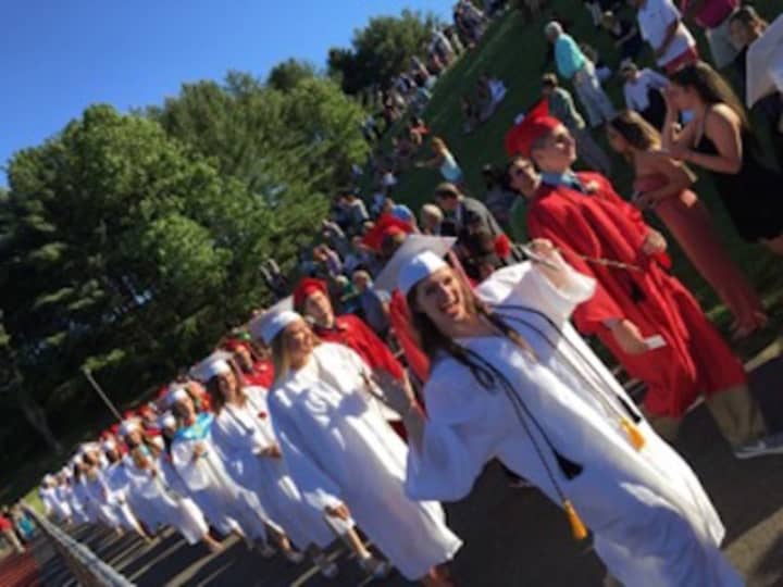 The Processional marches onto the field for the Masuk High graduation on Tuesday.