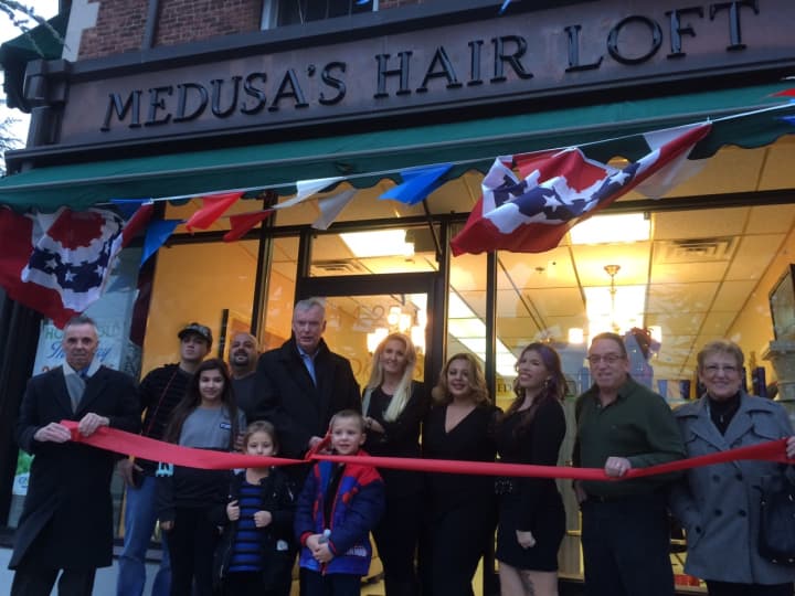 Penny Karagiorgis with members of the Fair Lawn Chamber of Commerce and Mayor John Cosgrove at the grand opening of Medusa Hair Loft.