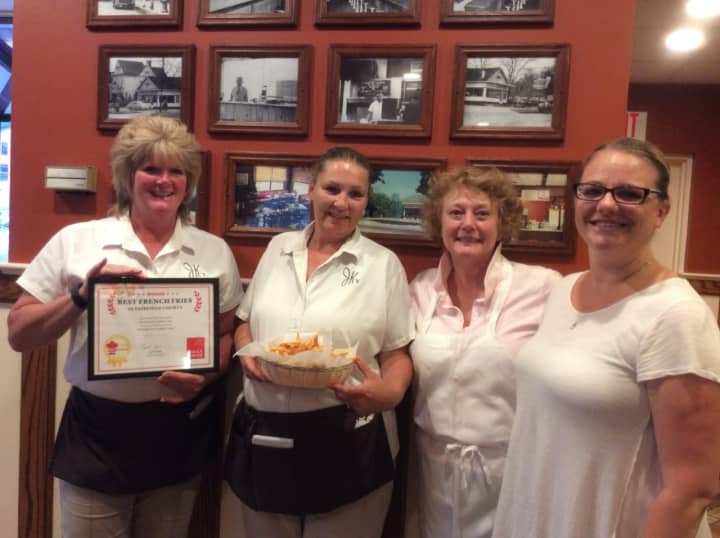 The crew at JK&#x27;s - Original Texas Hot Weiners in Danbury accepts the certificate for Best French Fries In Fairfield County.