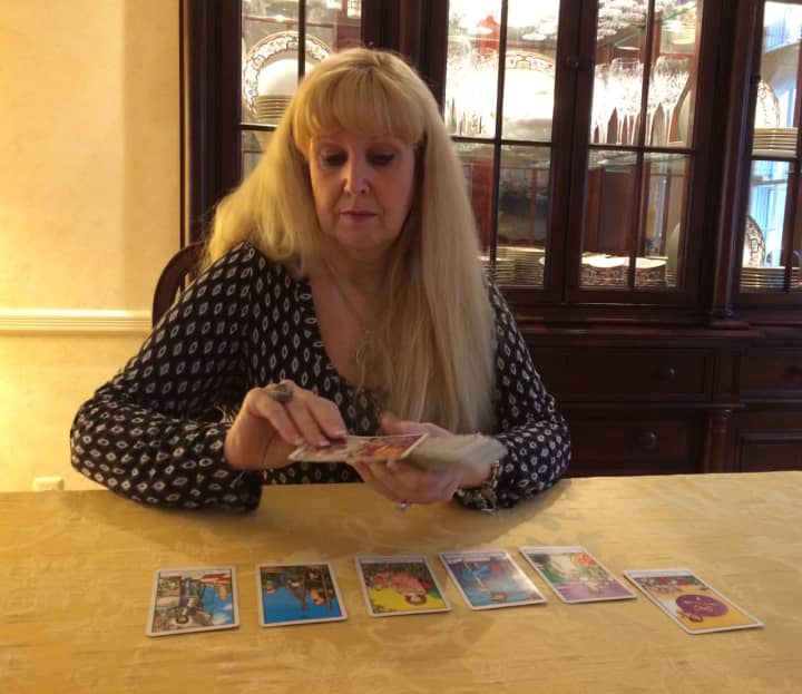 Cindy Muni lays her cards on the table of her Wyckoff home.