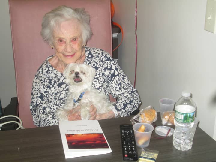 Audrey Rodgers, with her dog Mikey, has recently published her memoirs.