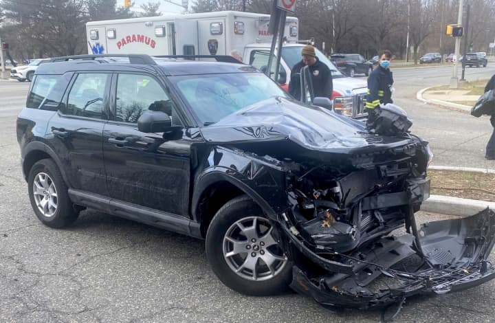 The driver walked to an ambulance after the crash at South Paramus Road and Mack Center Drive just off the Garden State Parkway in Paramus at 10 a.m. March 17.