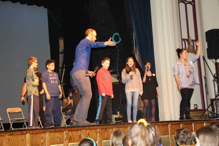 Students performing with &quot;The Swingles.&quot;